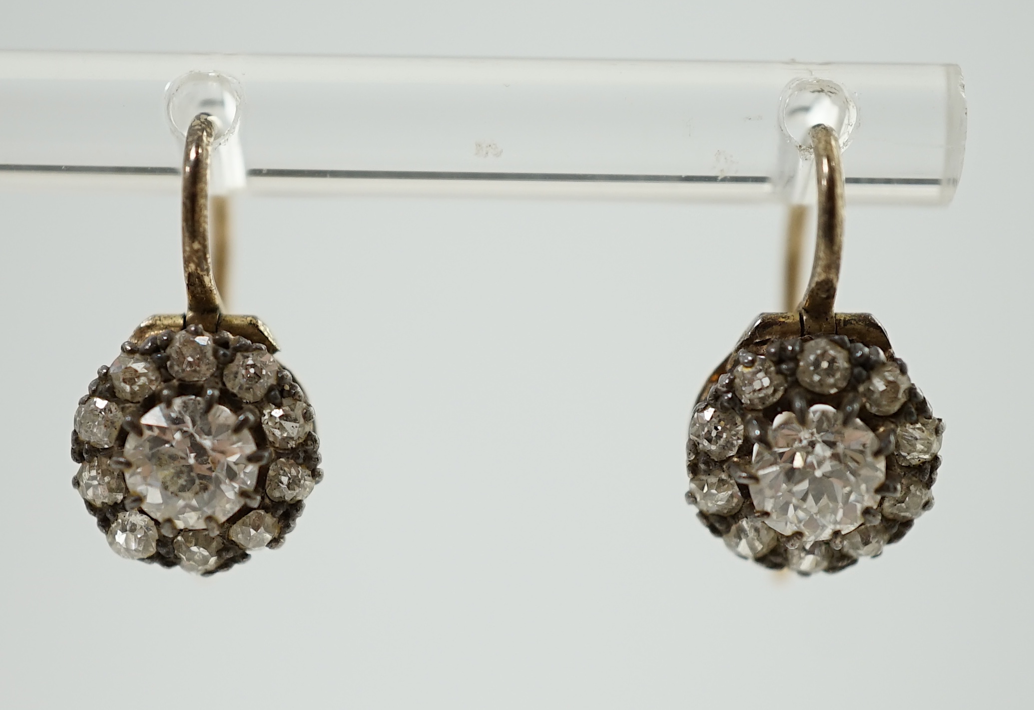 A pair of late Victorian gold and diamond cluster set earrings